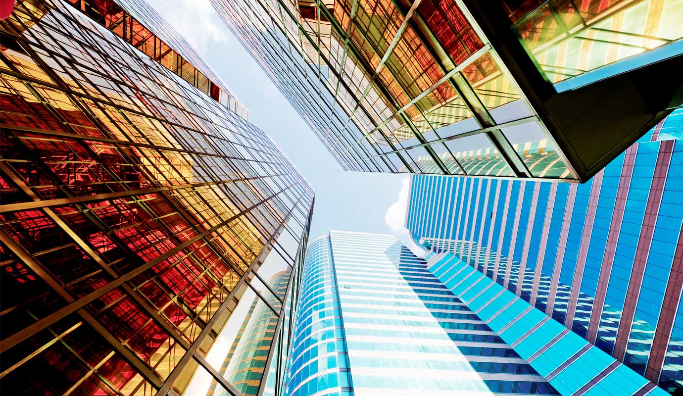 Low angle shot of modern glass city buildings