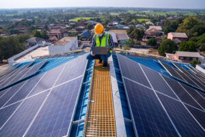 Man between solar panels